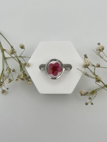 Anillo redondo fondo transparente con flor burdeos