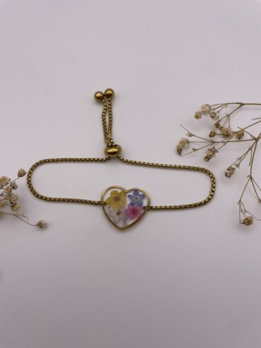 Pulsera corazón con flores azules, amarilla y rosa